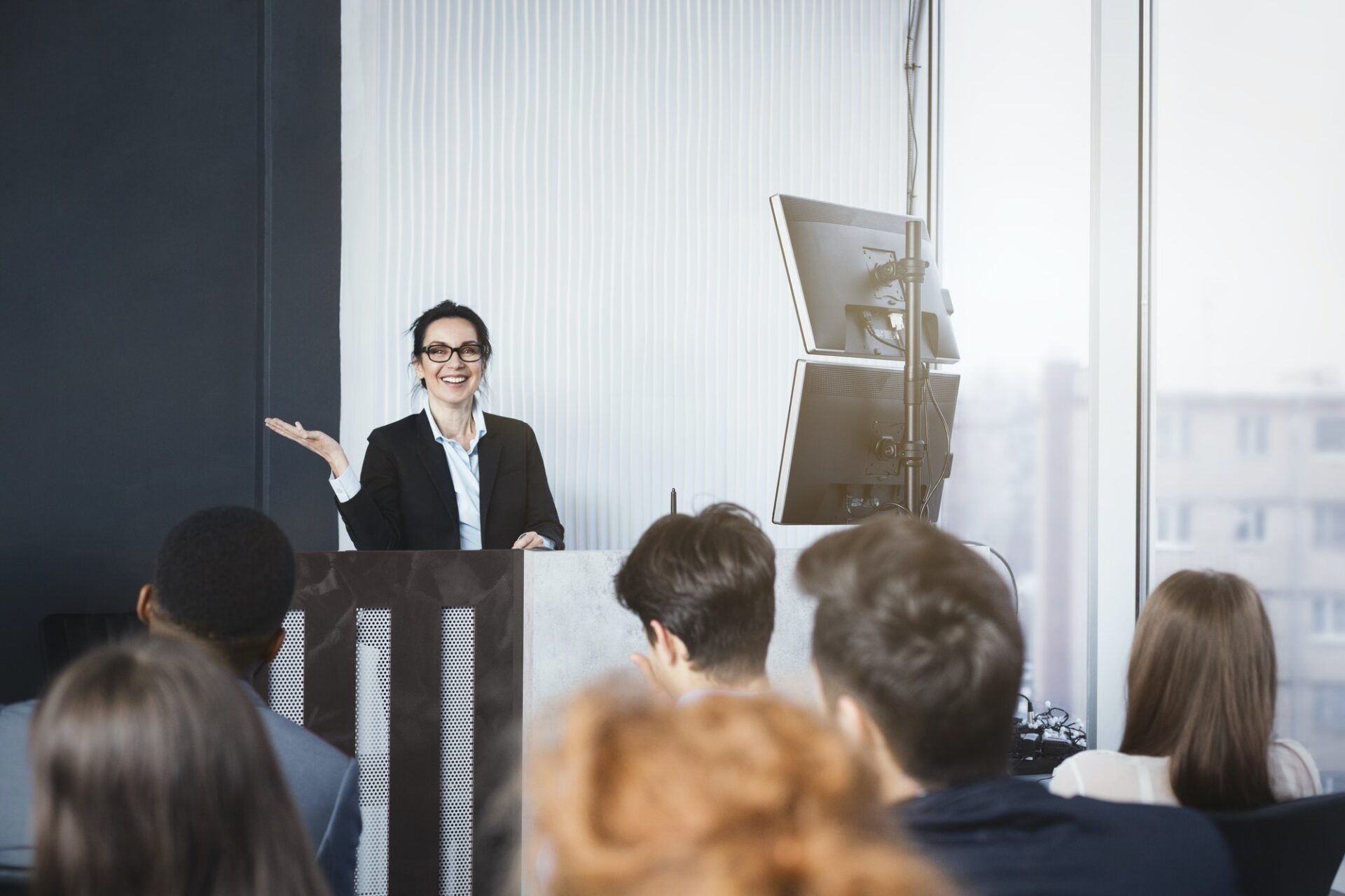Business woman giving presentation at conference room