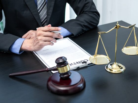 Male lawyer working with legal case document contract in office